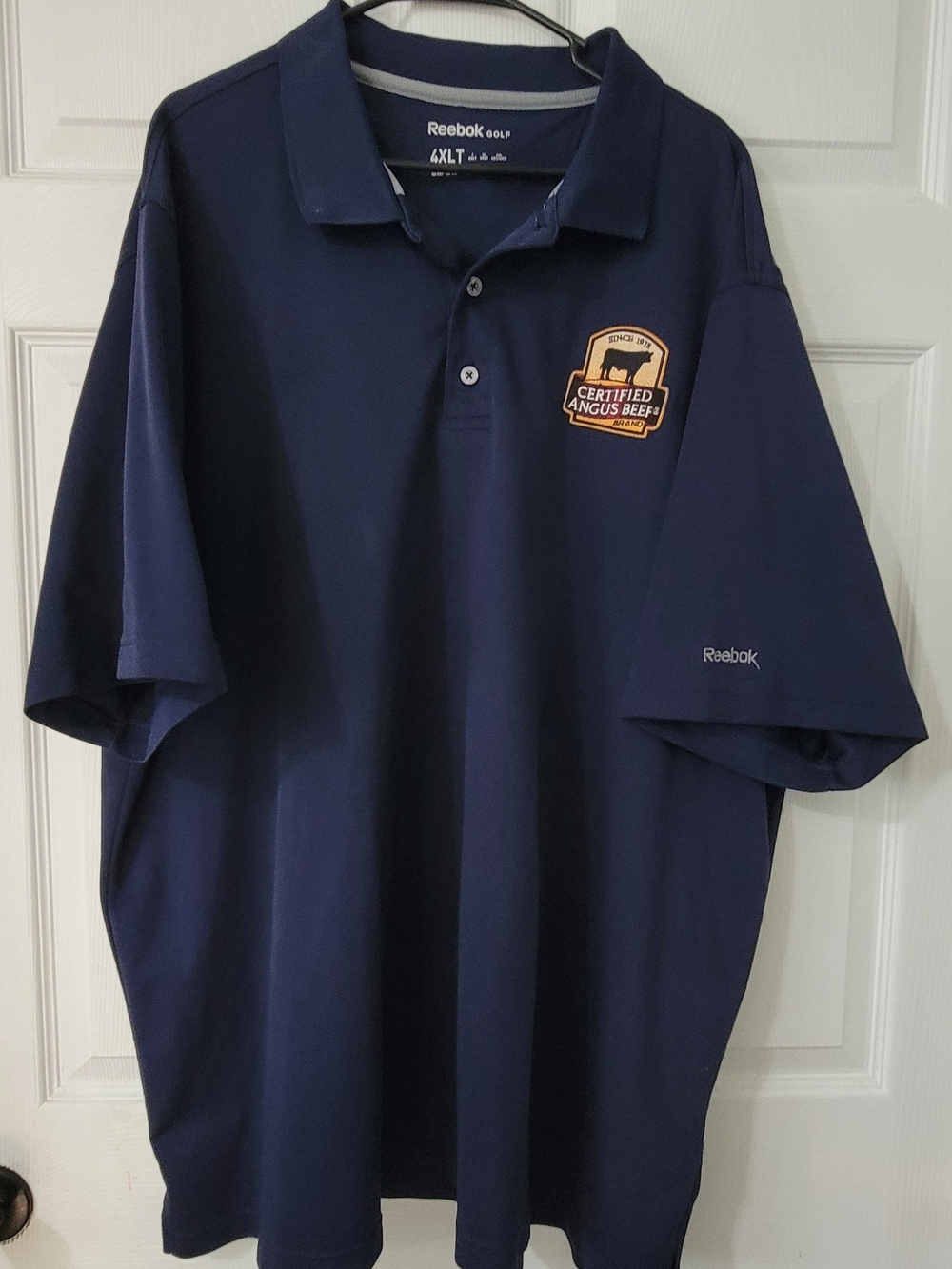 Reebok Men’s Navy Polo with Certified Angus Beef Patch